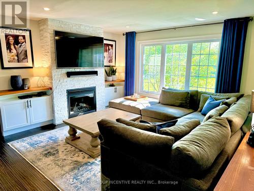 7590 8Th Line, Essa, ON - Indoor Photo Showing Living Room With Fireplace