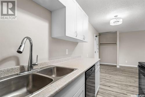 306 307 Tait Crescent, Saskatoon, SK - Indoor Photo Showing Kitchen With Double Sink