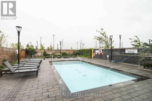 223 - 1050 Main Street, Milton, ON - Outdoor With In Ground Pool