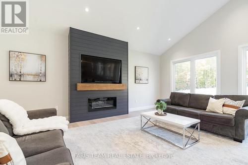 1250 Old Parry Sound Road, Muskoka Lakes, ON - Indoor Photo Showing Living Room With Fireplace