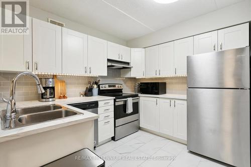 119 - 2030 Cleaver Avenue, Burlington, ON - Indoor Photo Showing Kitchen With Stainless Steel Kitchen With Double Sink