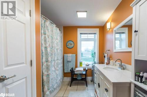 Bathroom featuring vanity, tile patterned floors, and a shower with curtain - 145 Farley Avenue Unit# 103, Belleville, ON - Indoor Photo Showing Bathroom