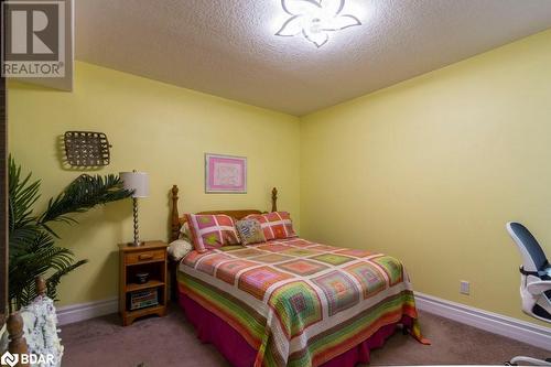 Bedroom with a textured ceiling and carpet - 145 Farley Avenue Unit# 103, Belleville, ON - Indoor Photo Showing Bedroom