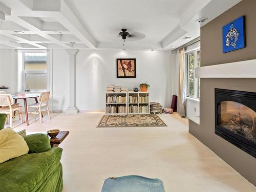 909 Mcmillan Avenue, Winnipeg, MB - Indoor Photo Showing Living Room With Fireplace