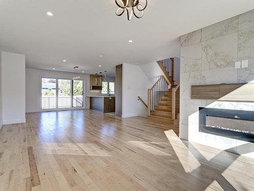 Living room - 6535 Rue Poitou, Brossard, QC - Indoor With Fireplace