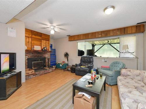 2011 / 2009 Idlemore Rd, Sooke, BC - Indoor Photo Showing Living Room With Fireplace