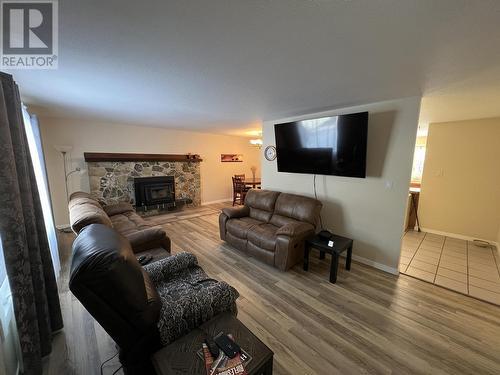 5324 51 Street, Fort Nelson, BC - Indoor Photo Showing Living Room With Fireplace