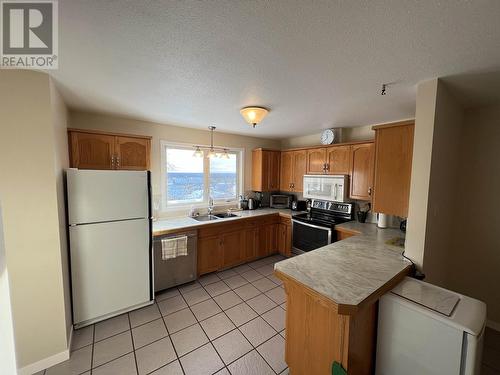 5324 51 Street, Fort Nelson, BC - Indoor Photo Showing Kitchen With Double Sink