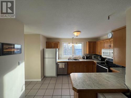 5324 51 Street, Fort Nelson, BC - Indoor Photo Showing Kitchen With Double Sink