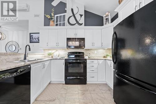 1003 - 325 Densmore Road, Cobourg, ON - Indoor Photo Showing Kitchen With Double Sink