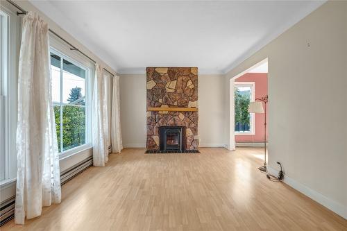 610 Vedette Drive, Penticton, BC - Indoor Photo Showing Living Room With Fireplace