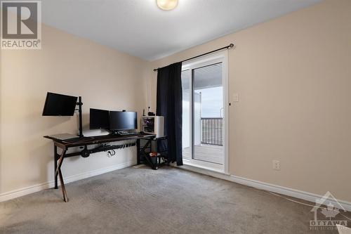 Bedroom with door leading to outside balcony - 220 Pilot Private, Ottawa, ON - Indoor Photo Showing Other Room