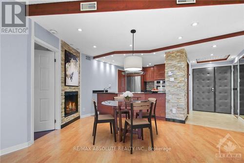 702 - 2019 Carling Avenue, Ottawa, ON - Indoor Photo Showing Dining Room With Fireplace