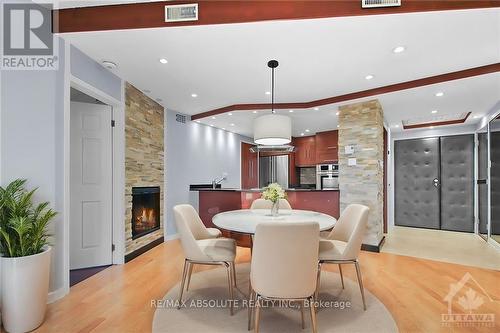 702 - 2019 Carling Avenue, Ottawa, ON - Indoor Photo Showing Dining Room With Fireplace