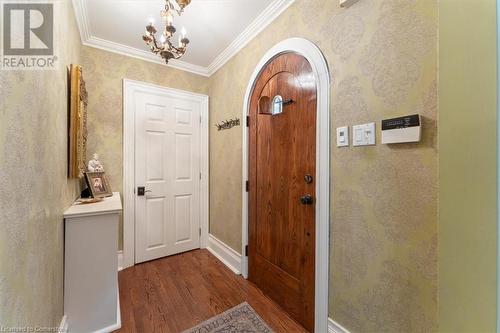 Foyer. High end brass fixture. Speakeasy on front door. - 3040 First Street, Burlington, ON - Indoor Photo Showing Other Room