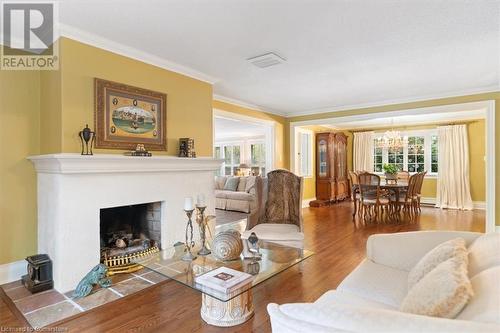 Refinished hardwood. Peterson Gas fireplace. Open concept living and dining rooms. - 3040 First Street, Burlington, ON - Indoor Photo Showing Living Room With Fireplace