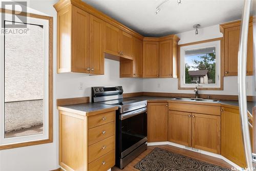 714 Callander Crescent N, Regina, SK - Indoor Photo Showing Kitchen With Double Sink