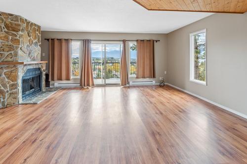 1/2/3 - 2303 Crawford Street, Creston, BC - Indoor Photo Showing Living Room With Fireplace