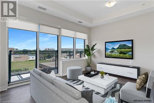 Virtually Staged - 121 #8 Highway Unit# 516, Stoney Creek, ON - Indoor Photo Showing Living Room