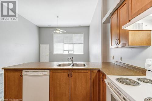 111 Grey Street Unit# 214, Brantford, ON - Indoor Photo Showing Kitchen With Double Sink