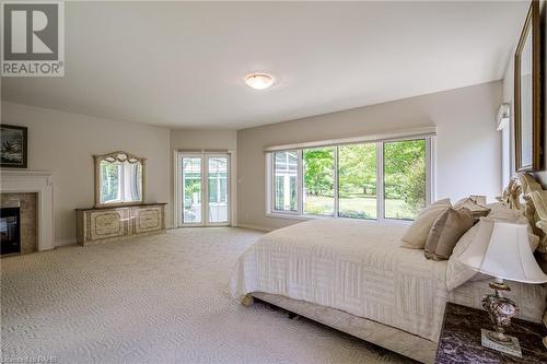 53 Ranch Road, Brantford, ON - Indoor Photo Showing Bedroom With Fireplace