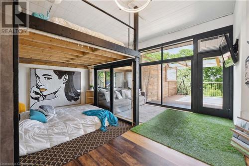 floor to ceiling windows in back of garage! - 33 Leslie Drive, Stoney Creek, ON - Indoor Photo Showing Bedroom