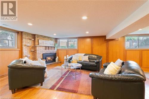 Large family room with cozy fireplace - 185 Nugent Drive, Hamilton, ON - Indoor With Fireplace