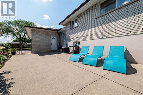 Fully fenced in yard with concrete patio - 185 Nugent Drive, Hamilton, ON - Outdoor With Exterior