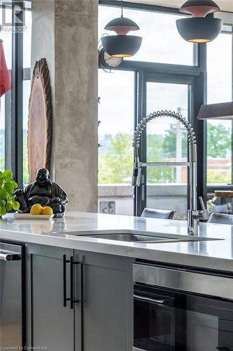 101 Locke Street S Unit# 304, Hamilton, ON - Indoor Photo Showing Kitchen With Double Sink