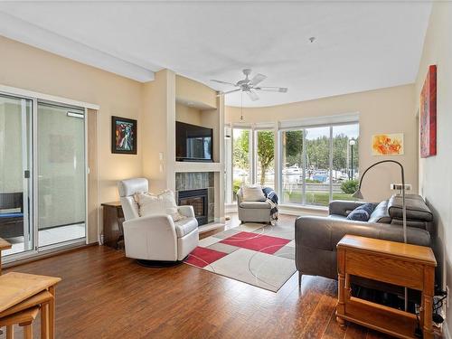 104-566 Stewart Ave, Nanaimo, BC - Indoor Photo Showing Living Room With Fireplace