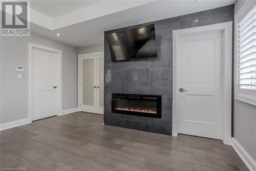 His and Hers Walk-In closets! - 474 Dewitt Road, Stoney Creek, ON - Indoor Photo Showing Living Room With Fireplace