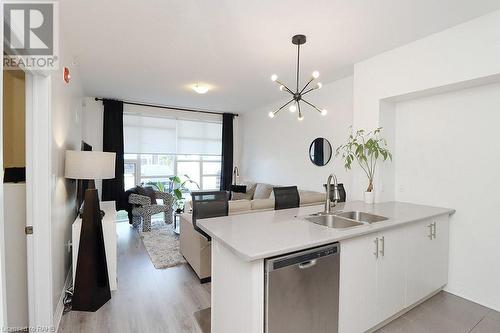 10 Concord Place Unit# 104, Grimsby, ON - Indoor Photo Showing Kitchen With Double Sink