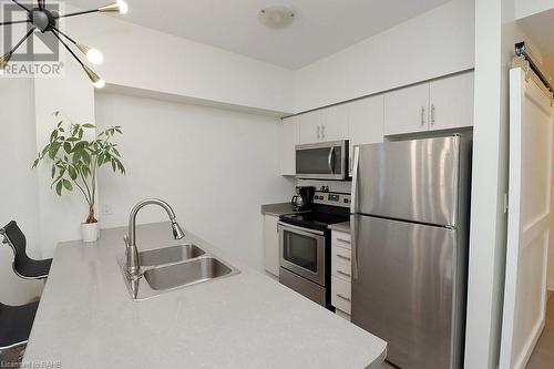 10 Concord Place Unit# 104, Grimsby, ON - Indoor Photo Showing Kitchen With Double Sink