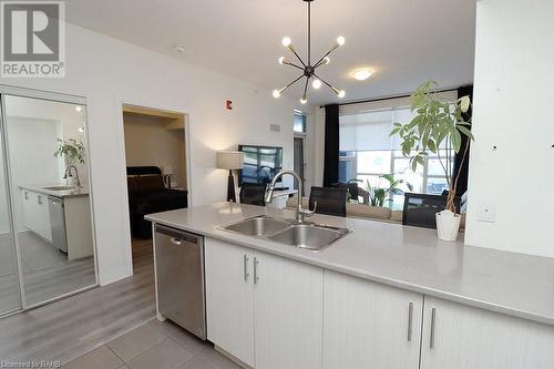 10 Concord Place Unit# 104, Grimsby, ON - Indoor Photo Showing Kitchen With Double Sink