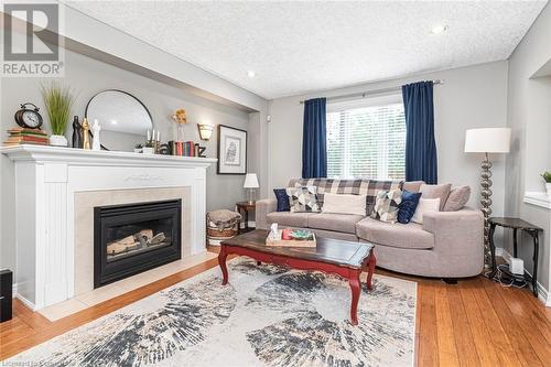 featuring gas fireplace - 54 Stonepine Crescent, Hamilton, ON - Indoor Photo Showing Living Room With Fireplace