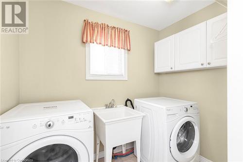 large main floor laundry room - 54 Stonepine Crescent, Hamilton, ON - Indoor Photo Showing Laundry Room