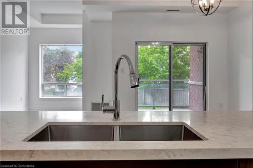 5070 Fairview Street Unit# 105, Burlington, ON - Indoor Photo Showing Kitchen With Double Sink