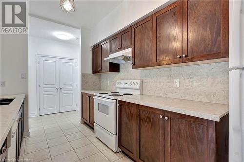 5070 Fairview Street Unit# 105, Burlington, ON - Indoor Photo Showing Kitchen With Double Sink