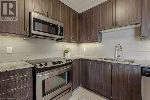 33 Whitmer Street Unit# 216, Milton, ON - Indoor Photo Showing Kitchen With Double Sink With Upgraded Kitchen