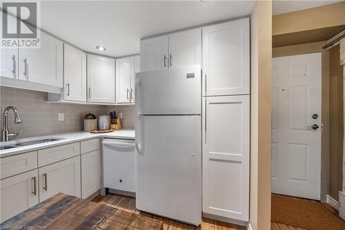 Ample cabinet storage - 1270 Maple Crossing Boulevard Unit# 204, Burlington, ON - Indoor Photo Showing Kitchen