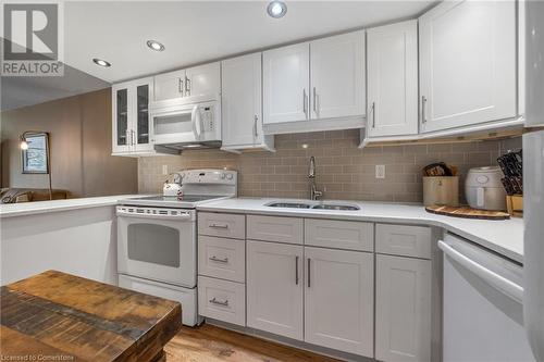 1270 Maple Crossing Boulevard Unit# 204, Burlington, ON - Indoor Photo Showing Kitchen With Double Sink