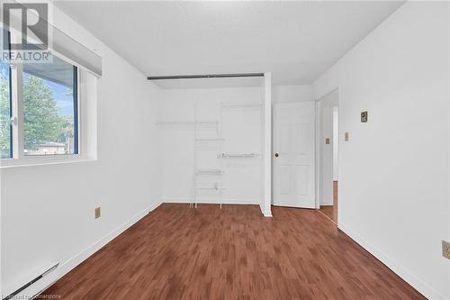 Open closet with shelving included - 482 James Street N Unit# 203, Hamilton, ON - Indoor Photo Showing Other Room