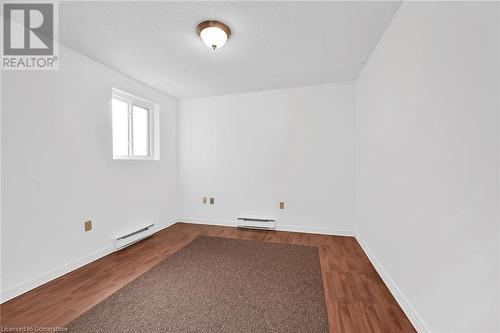 Second bedroom with window for natural light - 482 James Street N Unit# 203, Hamilton, ON - Indoor Photo Showing Other Room