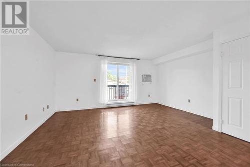 Living room with parquet floors - 482 James Street N Unit# 203, Hamilton, ON - Indoor Photo Showing Other Room