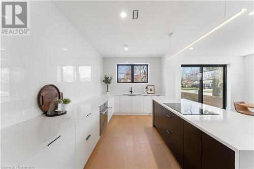 Kitchen with view to sliding doors. Steps down to private fenced patio - 5427 Anthony Place, Burlington, ON - Indoor Photo Showing Kitchen With Upgraded Kitchen