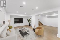 Lower level (virtually staged). Pot light, speakers. Adjacent bedroom, full bath, wine bar. - 