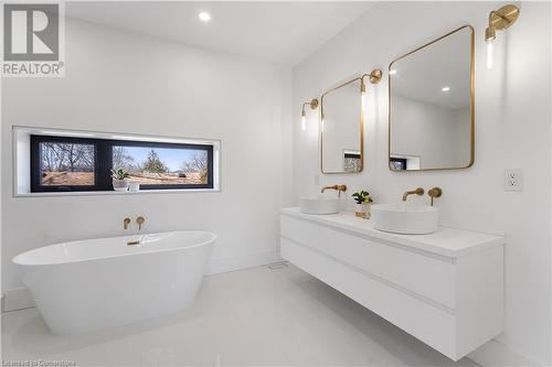 Master ensuite with double vessel sinks, soaker tub. Porcelain floor - 5427 Anthony Place, Burlington, ON - Indoor Photo Showing Bathroom