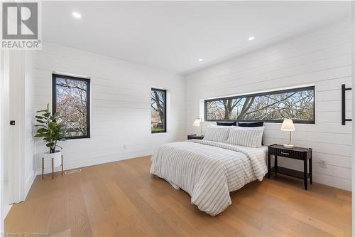 Master bedroom. Shiplap walls. - 5427 Anthony Place, Burlington, ON - Indoor Photo Showing Bedroom