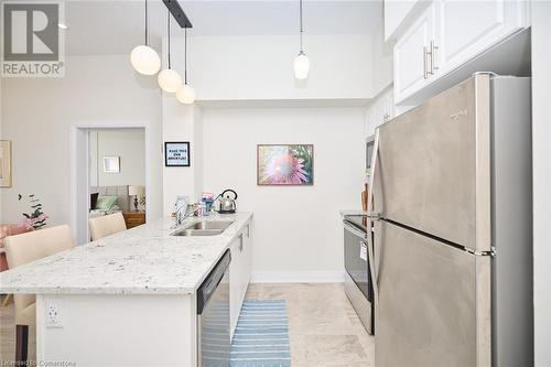 16 Concord Place Unit# 1006, Grimsby, ON - Indoor Photo Showing Kitchen With Double Sink