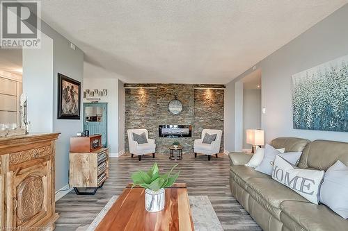 5250 Lakeshore Road Unit# 1907, Burlington, ON - Indoor Photo Showing Living Room With Fireplace